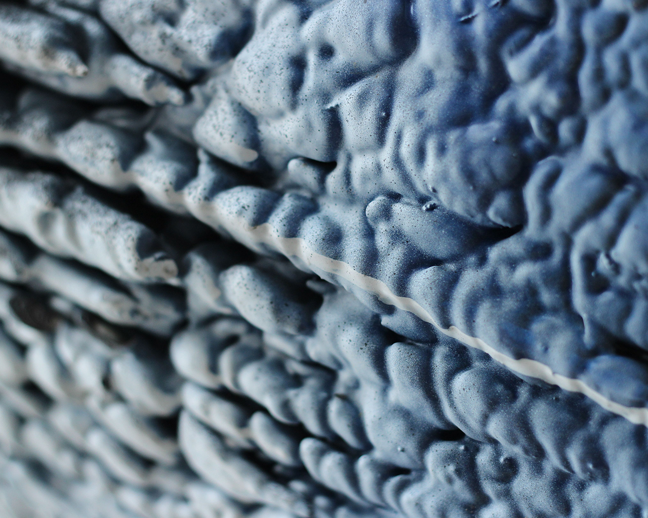 Abstract microscopic texture of neuronal structures, linked to drug development and research into Huntington's disease at Ferrer.