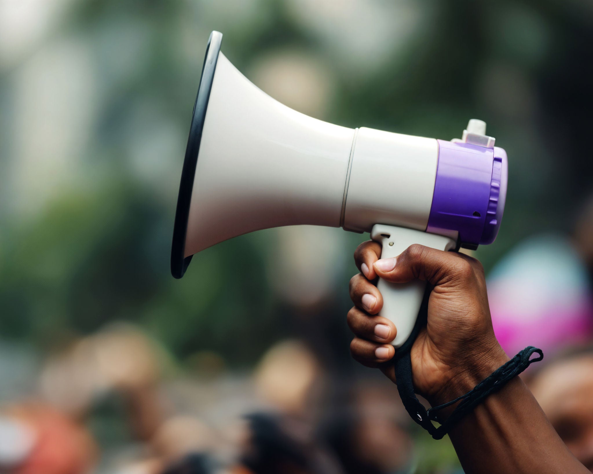 Hand holding a megaphone, symbolising news and updates.