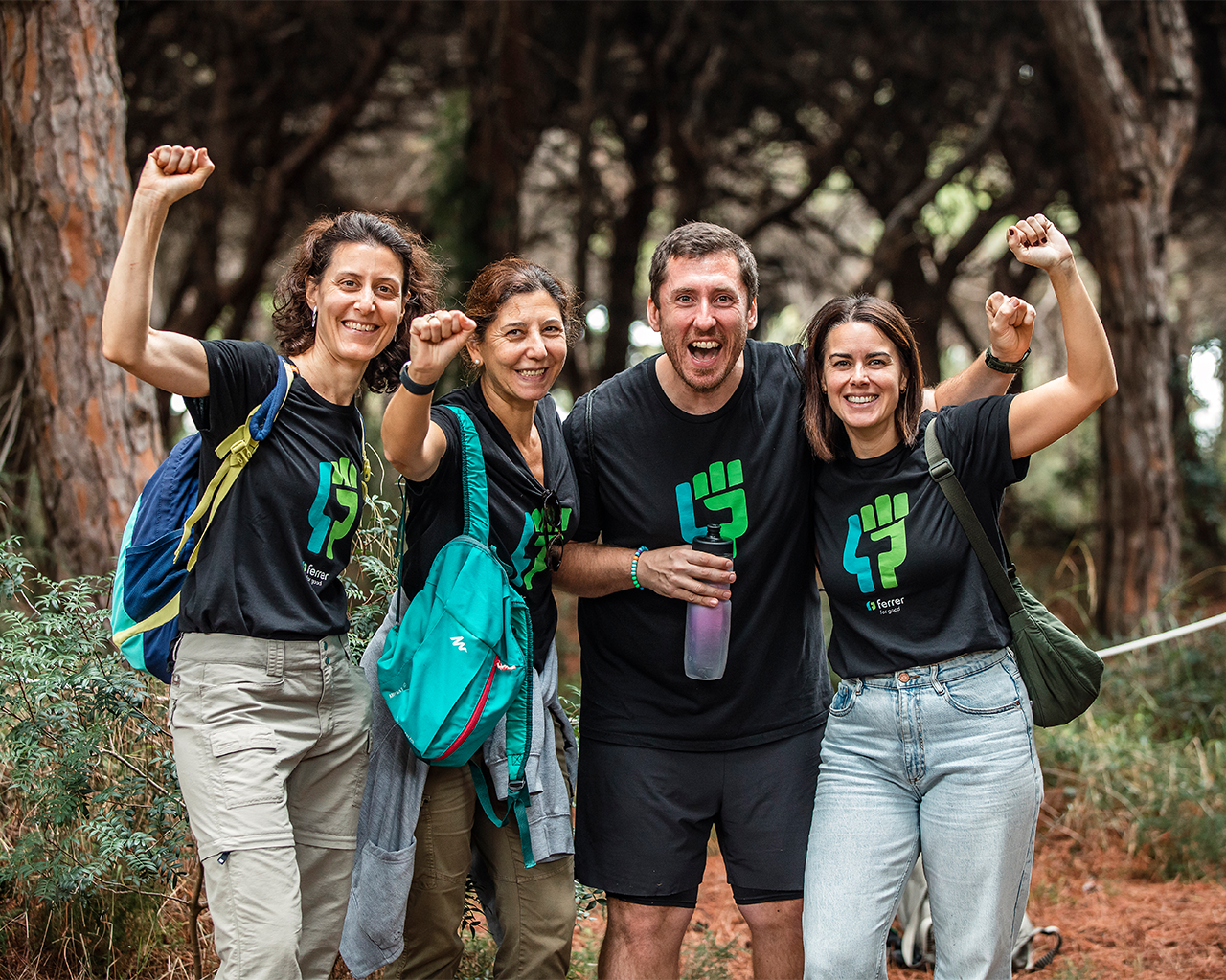 A team of volunteers from Grupo Ferrer celebrating during a day of corporate volunteering and social responsibility.